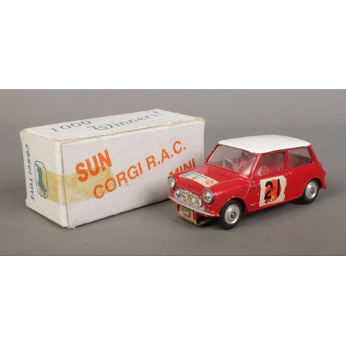 485 - A Corgi BMC Mini Cooper S, from '1000 Winners', in red with contrasting white roof. In white carded ... 