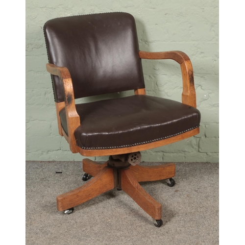 514 - A mid 1940's Astrola office desk chair with leather upholstery