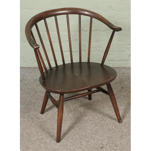 516 - An Ercol stick back tub chair