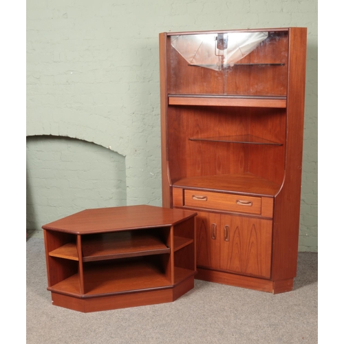 522 - Two pieces of G Plan teak corner furniture to include tv stand and cabinet featuring glass doors and... 