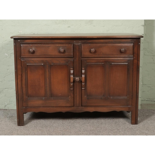 540 - A dark Ercol Old Colonial sideboard.