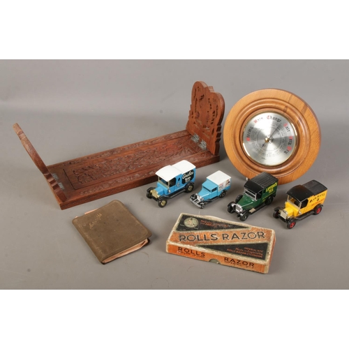 107 - A group of collectables. Includes Eastern book slide, Rolls Razor, barometer, autograph book with mi... 