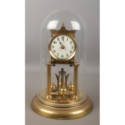 126 - A anniversary style clock with quartz movement. Housed under glass dome.