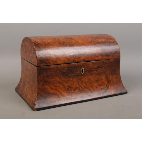A late Nineteenth/early Twentieth Century burr walnut tea caddy of D-shaped form with swooping sides. Featuring hinged lid and two section interior. Height: 15.5cm, Length: 26cm.