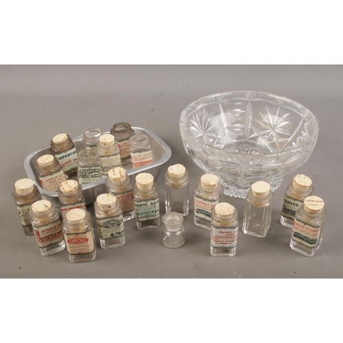 67 - A cut glass bowl and tray with contents of reproduction acid/poison bottles.