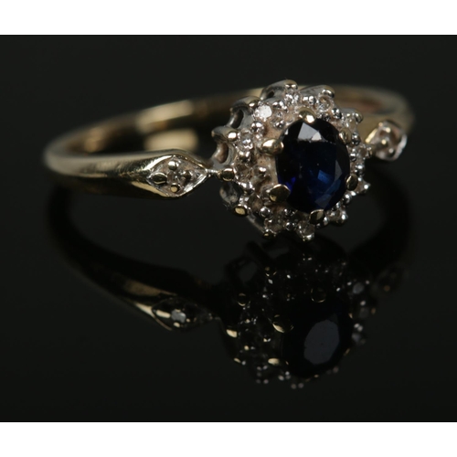 430 - A 9ct Gold Sapphire and Diamond halo cluster ring. Size M½. Total weight: 1.5g