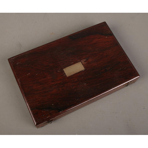 77 - An antique rosewood box with collection of Chinese coins/tokens.