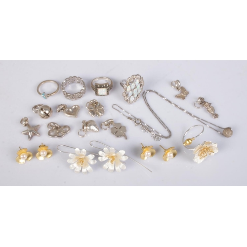 436 - A collection of silver jewellery, to include charms, ring set with opals and gilt examples.