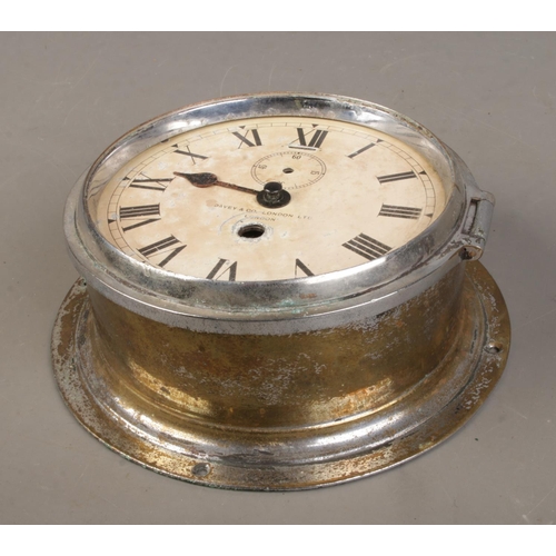 79 - A chrome plated ship's bulk head clock by Davey & Co, London.