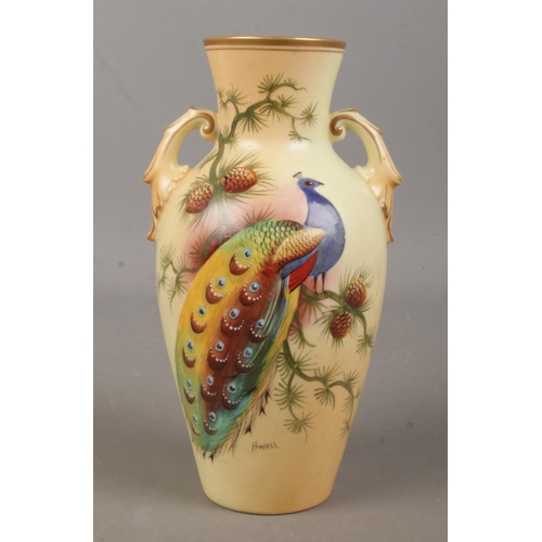 498 - A Locke & Co Worcester hand painted vase, decorated with a peacock. Signed H Wall. 19cm.