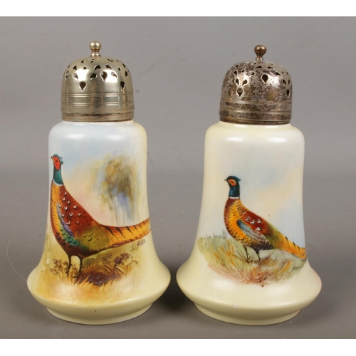 502 - Two Locke & Co Worcester sugar shakers. Both hand painted and decorated with a pheasant. Signed H Wa... 