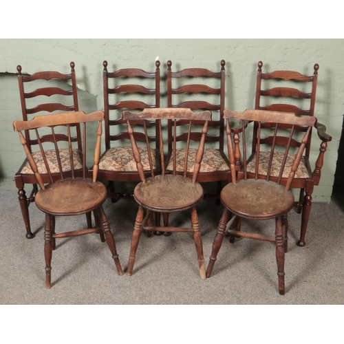 527 - A set of four ladder back chairs with another three stick back chairs