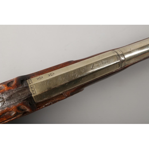 101 - A 19th century flintlock pistol, marked for Mackingtosh London. Having white metal barrel, trigger a... 