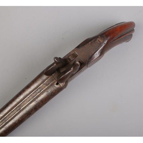 109 - A 19th century double barrel percussion pistol. Length 24.5cm. CANNOT POST OVERSEAS.