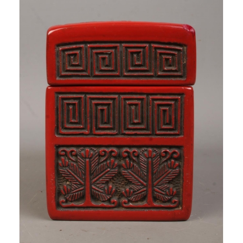 11 - A Chinese cinnabar lacquer card box. The cover decorated with a landscape scene. 9cm x 11cm x 6.5cm.