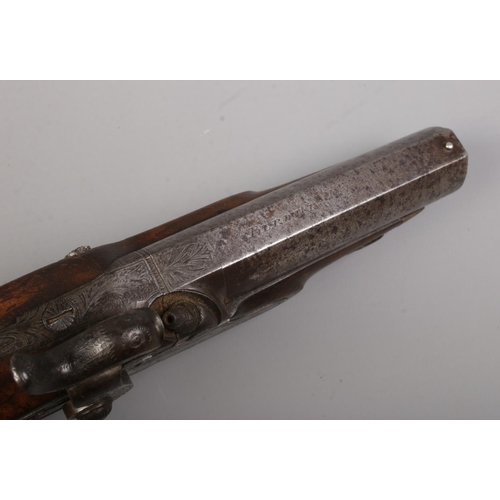 111 - A pair of 19th century percussion pistols. The lock plates marked for IM Burnie. Total length 21cm. ... 