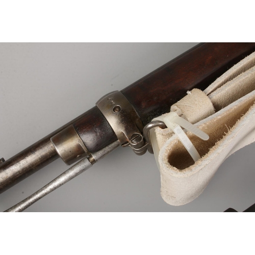 113 - A Victorian Enfield Martini Henry MkIII rifle. Dated 1884. With sling and socket bayonet in scabbard... 