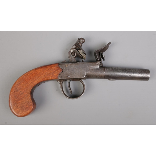 114 - A 19th century flint lock pistol with cylindrical screw off barrel. Stamped with indistinct makers m... 