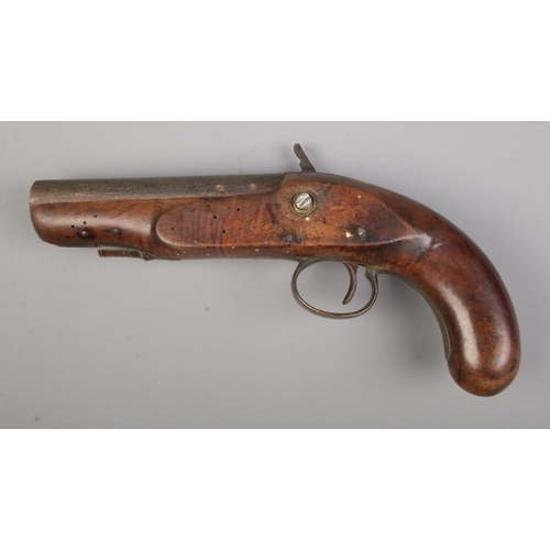 118 - A 19th century flint lock pistol. Total length 24cm. CANNOT POST OVERSEAS.