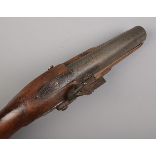 118 - A 19th century flint lock pistol. Total length 24cm. CANNOT POST OVERSEAS.