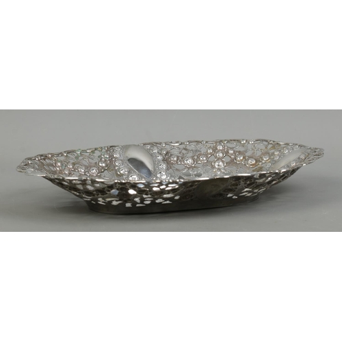 149 - An early 20th century German silver dish. Having pierced and floral border and central panel depicti... 