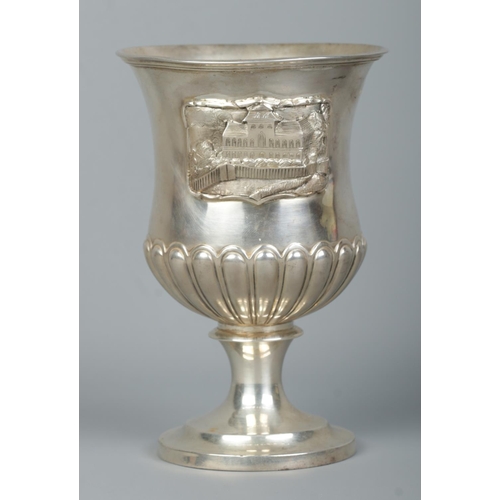 151 - A William IV silver goblet decorated in relief with landscape scenes and buildings. Assayed London 1... 