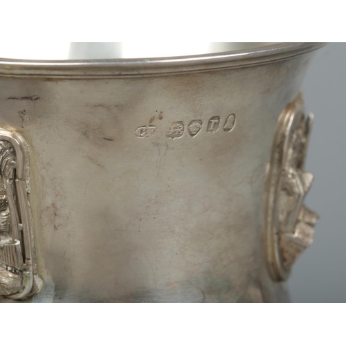 151 - A William IV silver goblet decorated in relief with landscape scenes and buildings. Assayed London 1... 