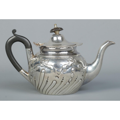 156 - A small Victorian silver bachelor teapot. With ebonised final and handle. Assayed Sheffield 1896 by ... 