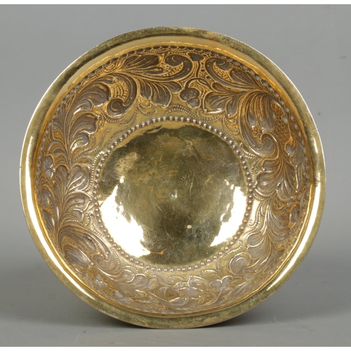 161 - A late 19th century silver gilt pedestal bowl with repousse decoration. London assay marks for 1891 ... 