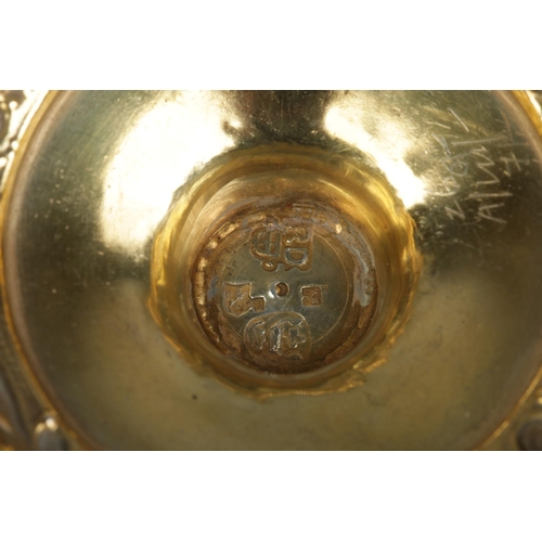 161 - A late 19th century silver gilt pedestal bowl with repousse decoration. London assay marks for 1891 ... 