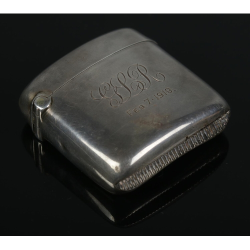 163 - A silver cigarette case along with a silver vesta case, both monogrammed GLR 1919. The cigarette cas... 