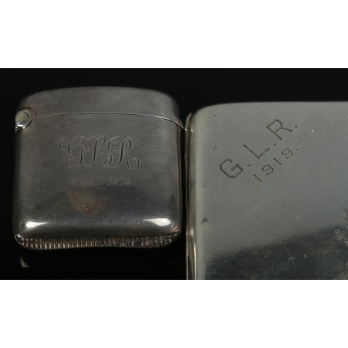 163 - A silver cigarette case along with a silver vesta case, both monogrammed GLR 1919. The cigarette cas... 