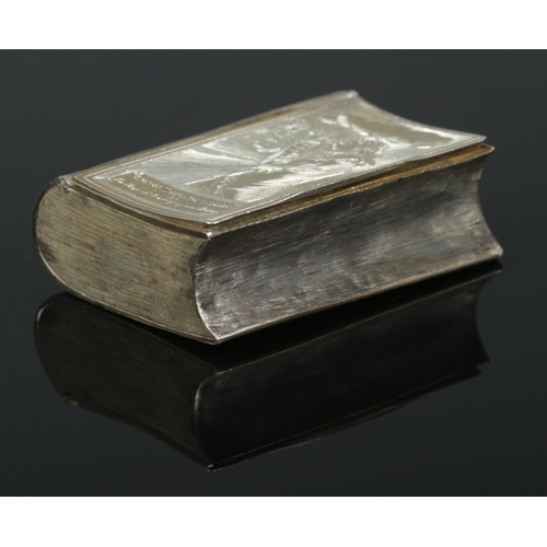 165 - A George III silver snuff box in the shape of a book. The front cover engraved after James Gillray; ... 