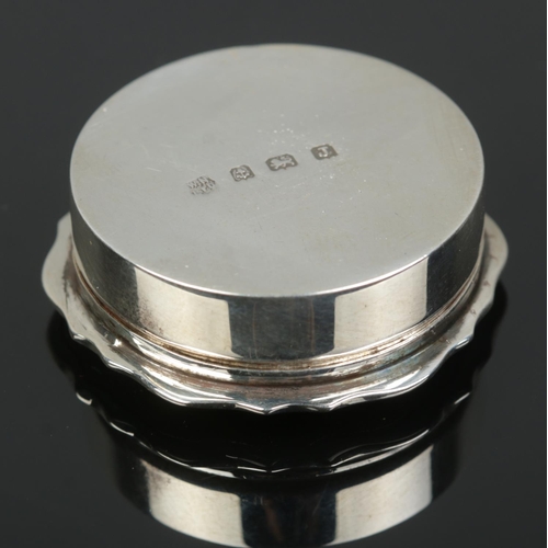 167 - A silver pill box with engine turned engraving to lid. Assayed Birmingham 1933 by William Neale & So... 