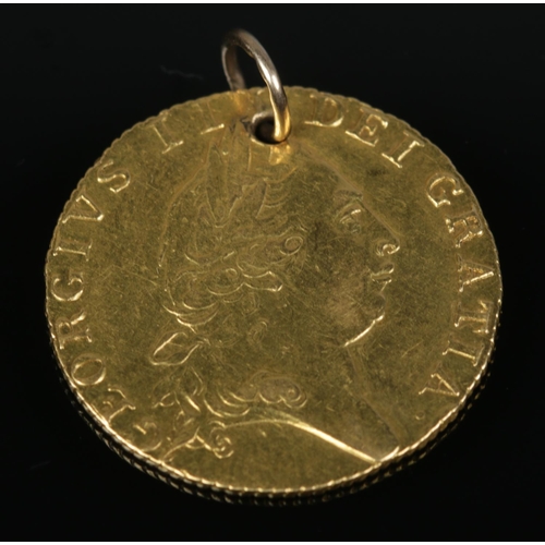 175 - A George III gold spade full guinea, dated 1790. 8.47g.