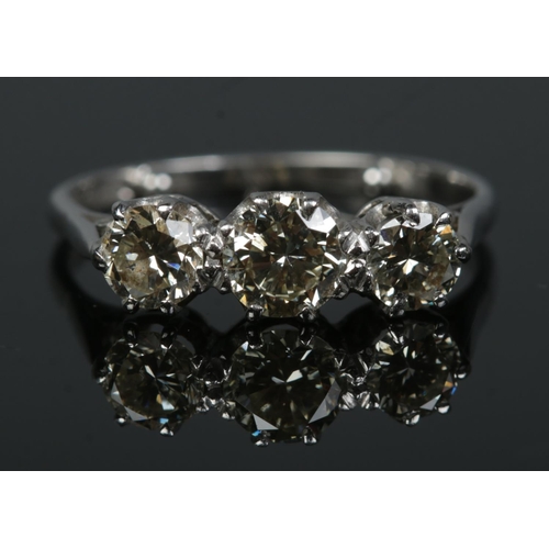 182 - An 18ct white gold and platinum three stone diamond ring. Total diamond approximately 1.25ct (centre... 