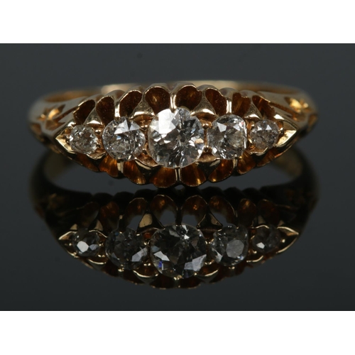 184 - An early 20th century 18ct gold five stone diamond ring in claw setting. Size N. 3.51g.