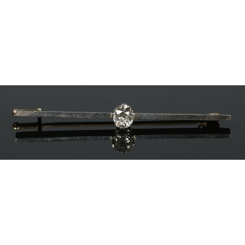 194 - A gold and platinum bar brooch set with a single diamond (approximately 0.75ct - 6mm x 5mm). Tested.... 