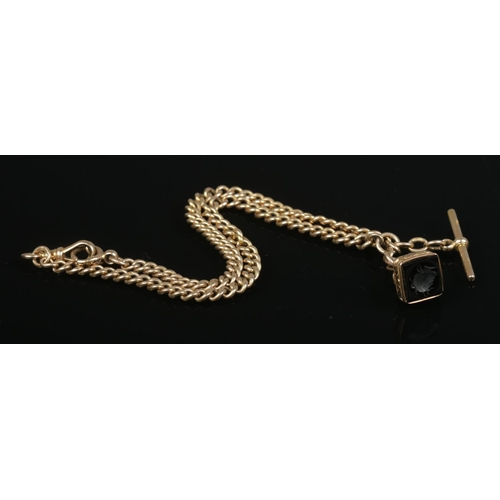 198 - A 9ct gold Albert chain with seal fob and T-bar. Approximate length 45cm. 46.2g (without fob).