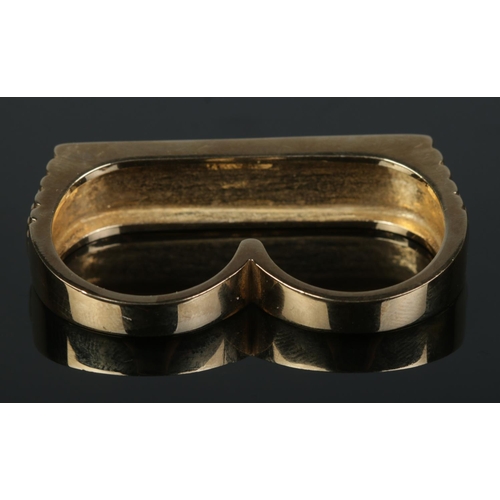 203 - A 9ct gold two finger ring. Sheffield 2003 with makers mark DAN. Size U and S 1/2. 22.31g.