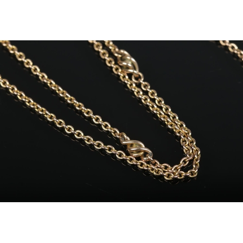 210 - A 9ct gold rolo link muff chain. Length 146cm. 29.74g.