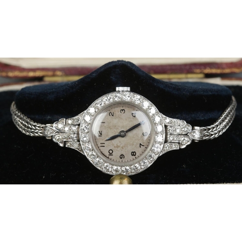 212 - A vintage ladies platinum and diamond manual cocktail watch on 9ct white gold rope twist strap. 19.8... 