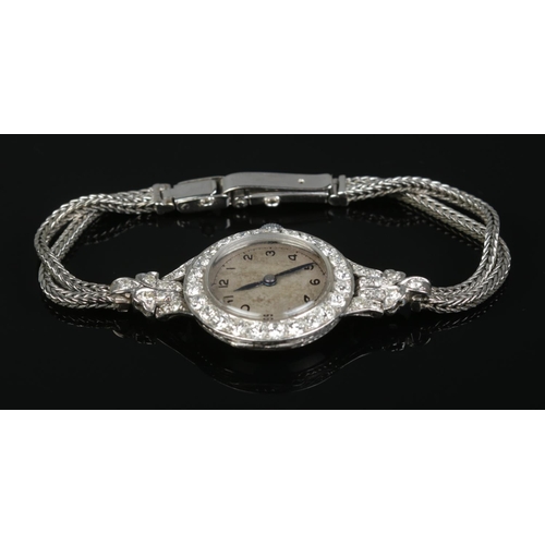 212 - A vintage ladies platinum and diamond manual cocktail watch on 9ct white gold rope twist strap. 19.8... 