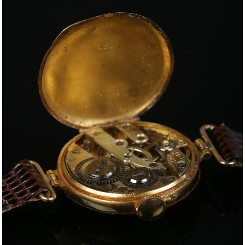 213 - A ladies 18ct gold, diamond and ruby manual wristwatch on leather strap with 9ct gold buckle.