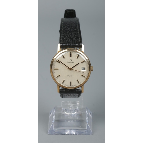 216 - A gents 9ct gold Omega Geneve manual wristwatch. Having centre seconds, baton markers and date displ... 