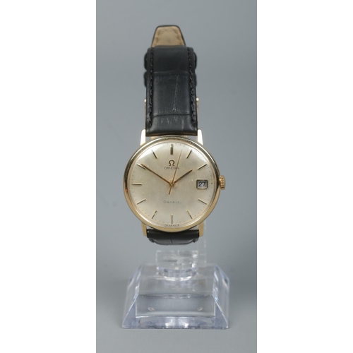 218 - A gents 9ct gold Omega Geneve manual wristwatch. Having centre seconds, baton markers and date displ... 