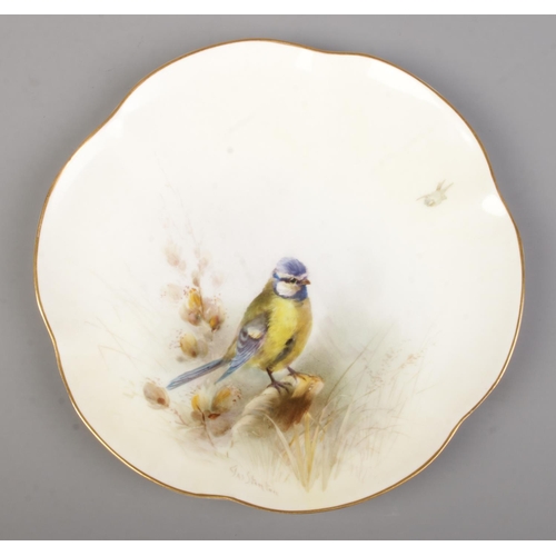 23 - James Stinton for Royal Worcester, three porcelain plates with hand painted scenes depicting birds i... 