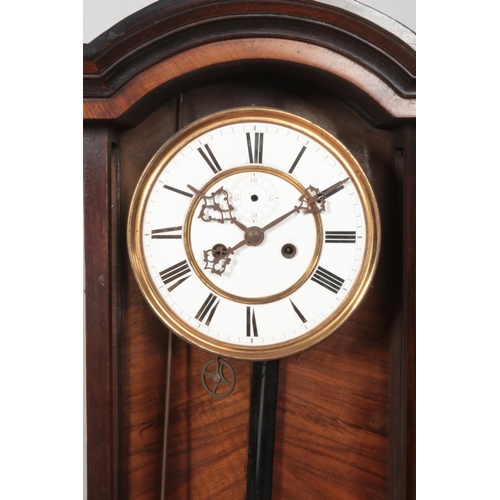 235 - A 19th century walnut Vienna twin weight wall clock. Having enamel dial and Roman numeral markers.