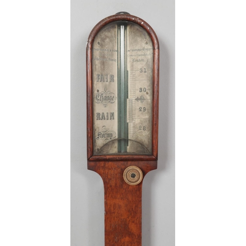 237 - An early 19th century Thomas Harris & Son oak stick barometer. Length 92cm.