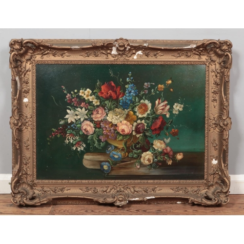 243 - A large gilt framed oil on board, still life with flowers. Unsigned. 53cm x 77cm.